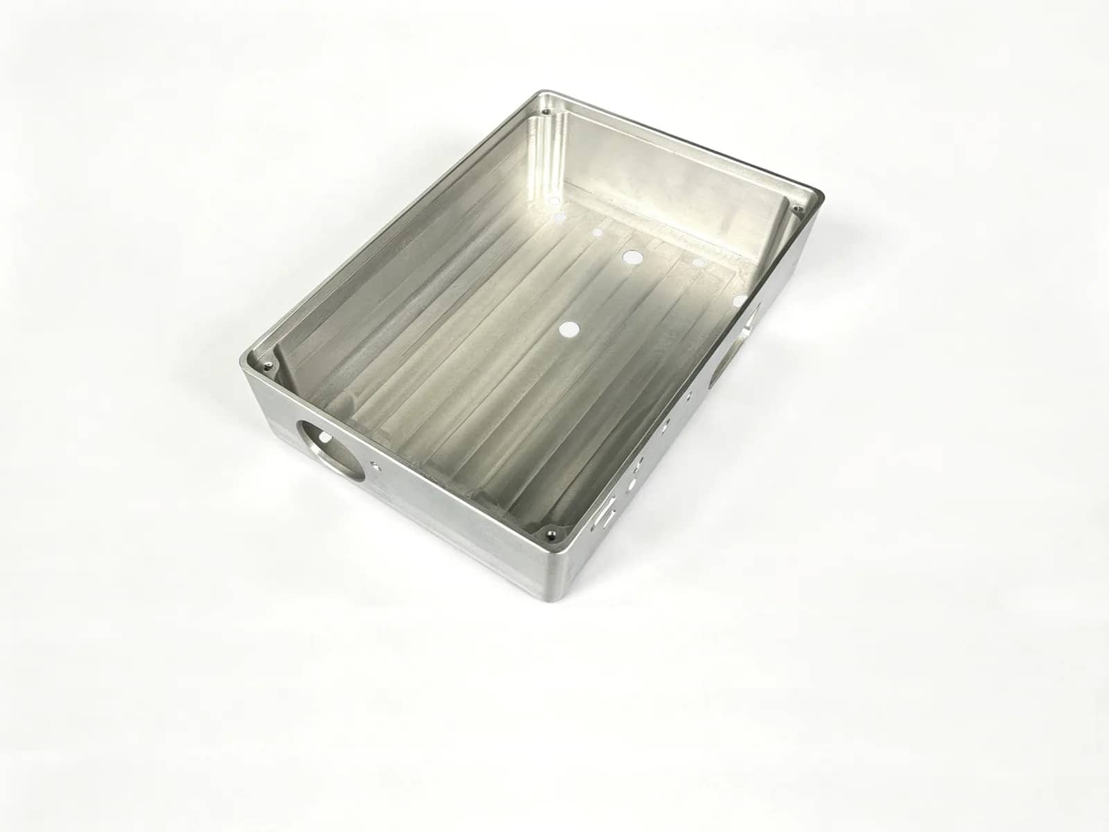 CNC-machined aluminum enclosure with a pocketed interior, side ports, and mounting holes