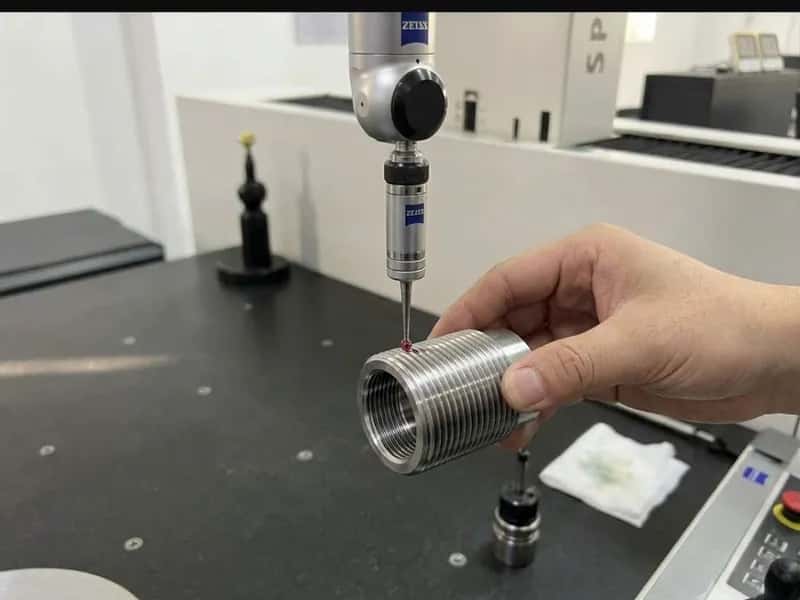 ZEISS CMM ruby probe measuring threads on a machined cylindrical fastener