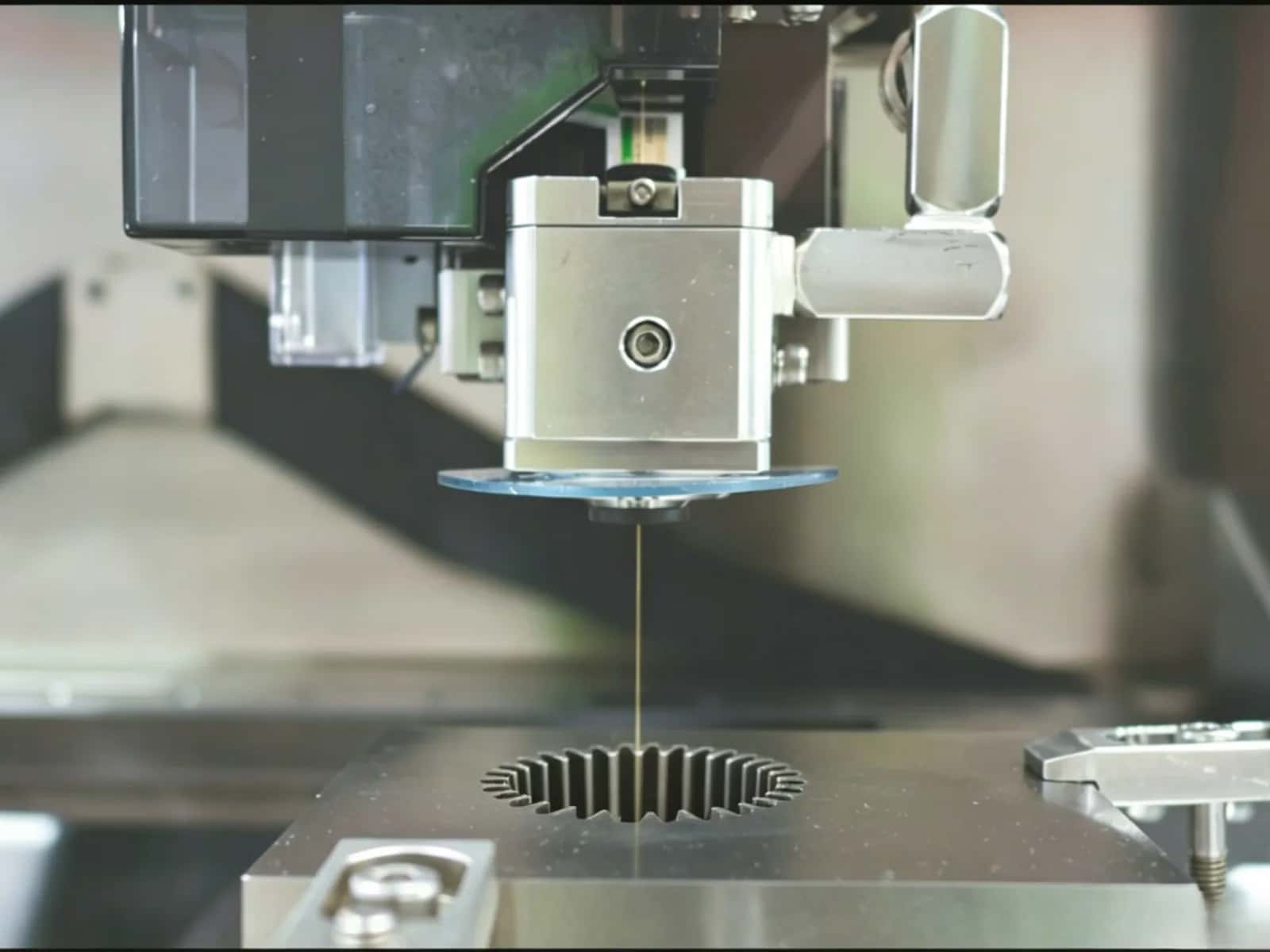 Wire EDM electrode wire centered in an internal spline cut through a clamped steel block